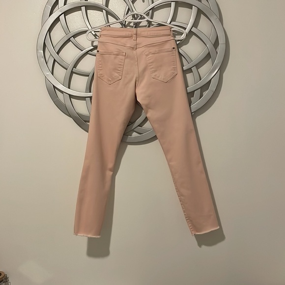 Peachy pink distressed skinny jeans. - Picture 3 of 3